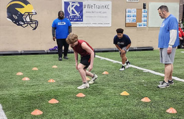 Defensive Line Football Training part of the Kansas City Athlete Training Football Acadmey focuses on the techniques needed to play an interior and edge rusher defensive line position such as tackle or nose or defensive end on the football field. We work every class on an athlete's stance then progress to gap alignment and using hands to strike the offensive player.  This class is highly recommended for any youth and/or middle school player looking to be successful playing defensive line.